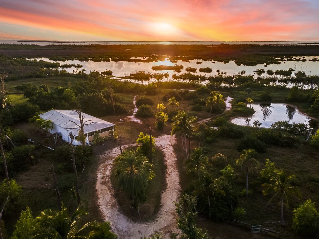 Aerial twilight photo of a secluded waterfront property in St. James City, Florida